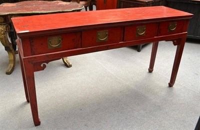 Lot 1255 - A Chinese Red Lacquer Side Table, 20th century, with four drawers, raised on hoof feet, 160cm wide