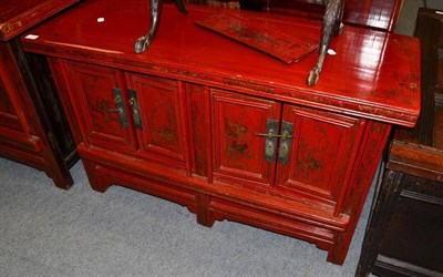 Lot 1256 - A Chinese Red Lacquer Parcel Gilt Side Cabinet, 20th century, with four cupboard doors, 115cm wide