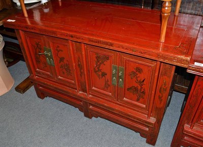 Lot 1257 - A Chinese Red Lacquer Parcel Gilt Side Cabinet, 20th century, with four cupboard doors, 118cm wide