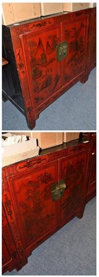 Lot 1258 - A Matched Pair of Chinese Red Lacquer Side Cabinets, 20th century, with cupboard doors...