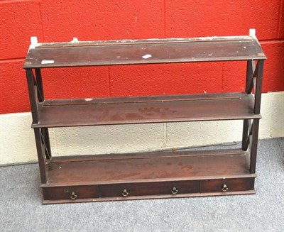 Lot 1277 - A Set of Late George III Mahogany Hanging Shelves, with three small drawers, 78cm wide