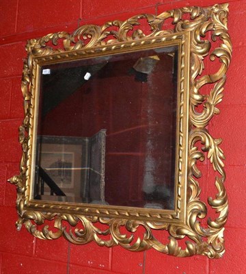 Lot 1281 - A 19th Century Carved Gilt Florentine Wall Mirror, with rectangular bevelled glass plate,...