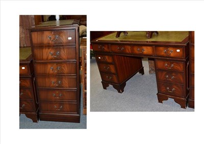 Lot 1300 - A Reproduction Mahogany Twin-Pedestal Desk, fitted with nine drawers, 136cm wide; and A...