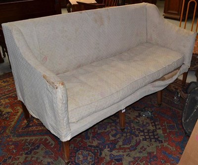 Lot 1311 - A George III Mahogany Sofa, raised on eight tapering legs with brass toes and castors, 183cm wide