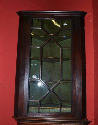 Lot 1325 - A George III Mahogany Glazed Hanging Corner Cupboard, with green painted interior, height 112cm