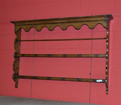 Lot 1329 - An 18th Century Oak Delft Rack, with two fixed shelves and iron cup hooks, 138cm wide