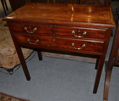 Lot 1337 - A George III Mahogany Side Table, late 18th century, the crossbanded top above two short and...