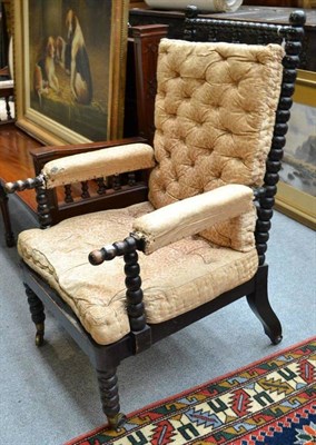 Lot 1346 - A Victorian Bobbin-Turned Ebonised Armchair, the square shaped frame with three bar splats,...