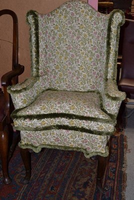 Lot 1349 - An Elegant Wingback Chair of Small Proportions, probably 18th century, recovered in floral...