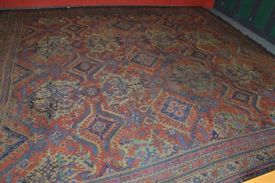 Lot 1376 - An Ushak Carpet of Unusual 'Square' Size West Anatolia The terracotta field with rows of hooked...