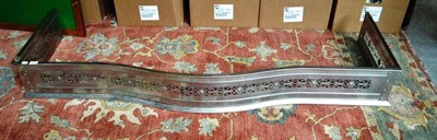 Lot 1378 - A Polished Steel Fender of serpentine shaped form, 172cm wide