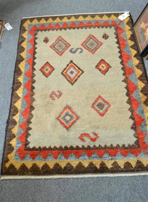 Lot 1462 - Gabbeh Rug South West Persia The ivory field with polychrome geometric devices enclosed by 'saw...