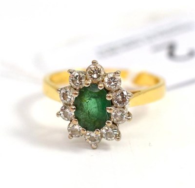 Lot 2 - An 18ct gold emerald and diamond cluster ring, total estimated diamond weight 0.50 carat...