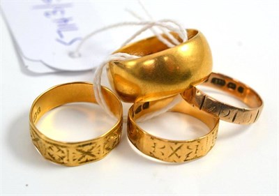 Lot 10 - 18ct gold wedding band, two others and a 9ct gold band (4)