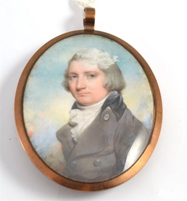 Lot 14 - English school (early 19th century) miniature portrait of young gentleman wearing a black...