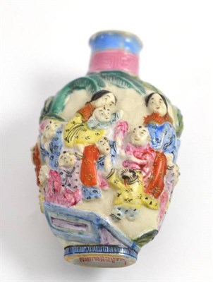 Lot 18 - A Chinese porcelain relief moulded snuff bottle, height 7.5cm