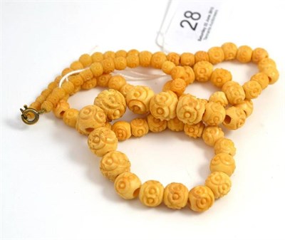 Lot 28 - A strand of ivory beads