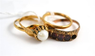 Lot 31 - A 9ct gold band ring, a cultured pearl ring, a signet ring and a garnet ring (4)