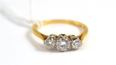 Lot 39 - A diamond three stone ring stamped '18CT' and 'PLAT', total estimated diamond weight 0.85 carat...