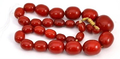 Lot 46 - A strand of tomato red amber beads