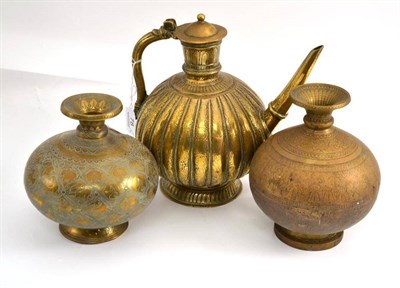 Lot 78 - 19th century Persian brass ewer, height 24cm and two Persian globular shaped vases, height 19cm