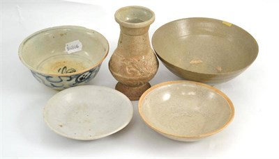 Lot 79 - A group of five early Chinese ceramics; comprising a Qingbai circular bowl, 14cm diameter, a...