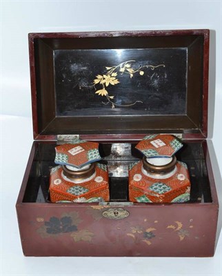 Lot 86 - Hinged lacquered box enclosing two Chinese scent bottles with stoppers