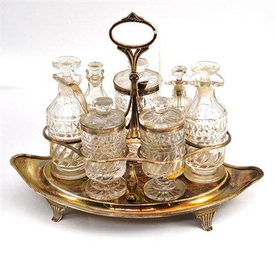 Lot 89 - A George III silver cruet stand, John Emes, London 1802, of navette form, engraved with cursive...
