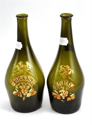 Lot 94 - Two green glass decanters gilt painted with 'Brandy' and 'Rum', height 27cm