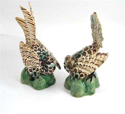 Lot 110 - A pair of Continental polychrome decorated bird ornaments, height 26cm