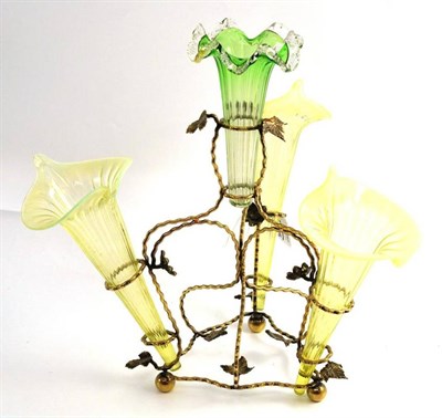 Lot 143 - A green vaseline epergne (one matched flute)