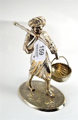 Lot 159 - A Victorian electroplated figural salt, cast as an Indian man carrying a basket and bambo...