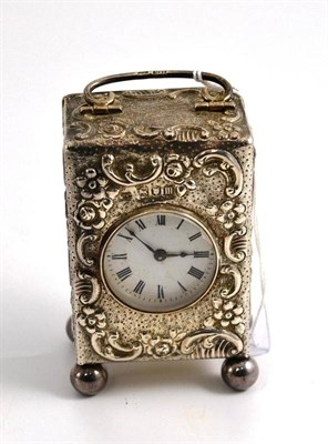 Lot 160 - A silver miniature travelling timepiece, 9cm