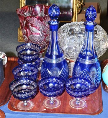 Lot 180 - A pair of blue flash glass decanters with stoppers, height 37cm, four matching sundae dishes,...