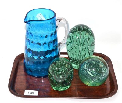 Lot 195 - Three Victorian green glass dumps and a blue glass jug (4)