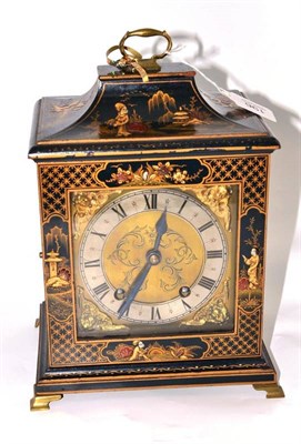 Lot 196 - A chinoiserie lacquered cased mantel clock with key