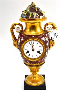 Lot 204 - A late 19th century French gilt timepiece modelled as a twin handled vase, height 32cm...