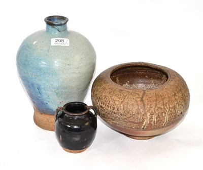 Lot 208 - Henan style black glazed vase, Jun style vase and a partially glazed vase, height 26cm, (3)