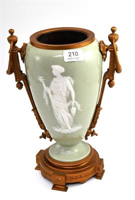 Lot 210 - A late 19th century pate-sur-pate oil lamp base of ovoid form decorated with a classical female...