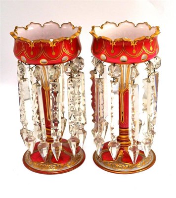 Lot 231 - A pair of late 19th/early 20th century pink glass and gilt decorated drop lustres, height 30cm