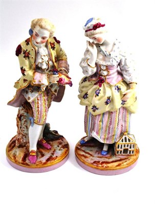 Lot 242 - A pair of late 19th century Continental figures of a courting lady and gentleman, height 30cm each