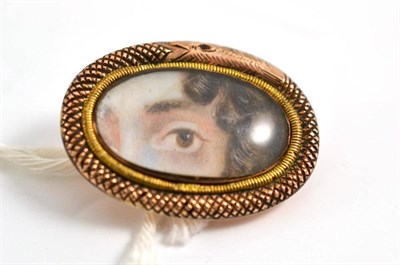 Lot 245 - An oval serpent brooch, with miniature of an eye