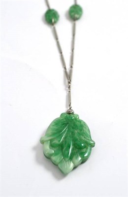 Lot 256 - A glass necklace, imitating Jade, and stamped 'PLATINON'