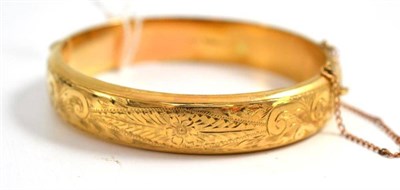 Lot 275 - A 9ct gold bangle