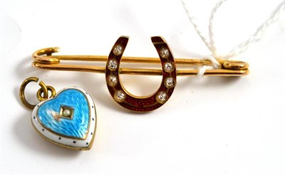 Lot 309 - An enamelled bar brooch and an enamelled heart shaped locket