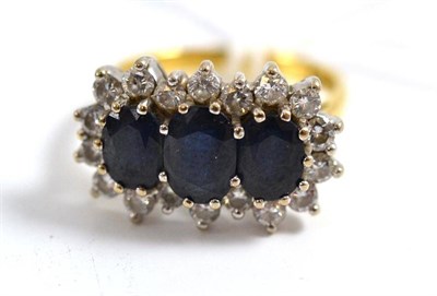 Lot 310 - A sapphire and diamond triple cluster ring