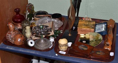 Lot 325 - Two trays of ornamental items including framed miniatures, tribal carvings, soapstone figures,...