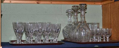 Lot 333 - A quantity of engraved drinking glasses of assorted sizes and three glass decanters with stoppers