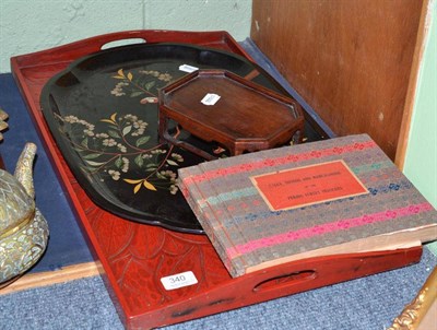 Lot 340 - Two Chinese lacquer trays, hardwood stand and Chinese book