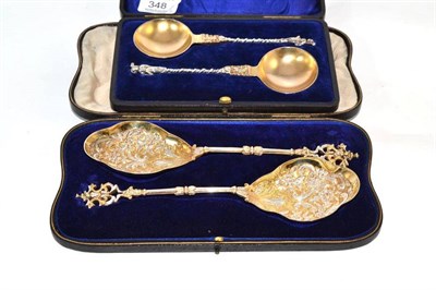 Lot 348 - Pair of silver gilt spoons (fitted case), London, assay, 1909; and a pair of silver gilt...